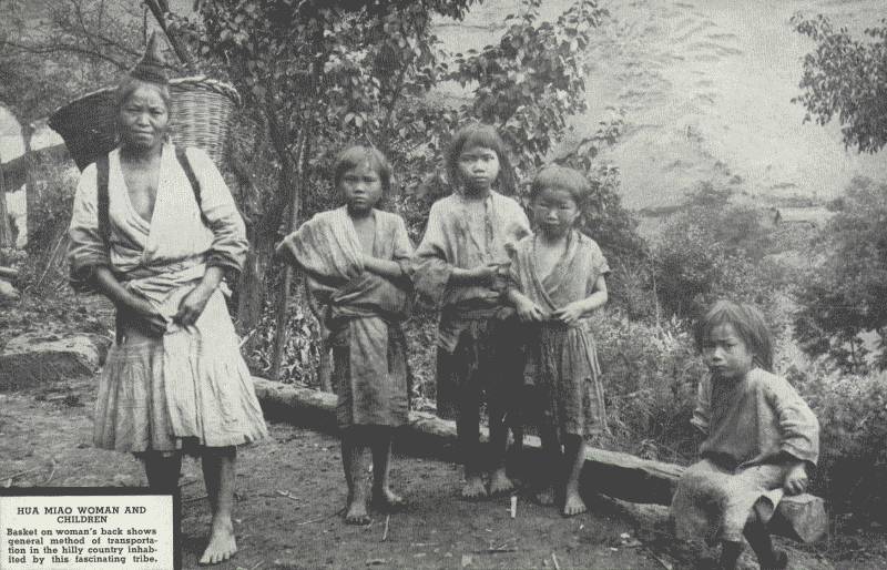 HUA MIAO WOMEN AND CHILDREN

Basket on woman's back shows general method of transportation in the
hilly country inhabited by this fascinating tribe.