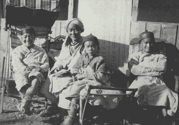 REFORMED HUA MIAO STUDENTS TAKING IT EASY

Picture shows how much they have benefitted under the missionary's
influence. Taken at the British mission compound in Tongch'uanfu.
