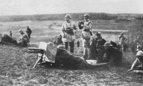 CAPT. CHEVALIER, OF THE FRENCH ARMY, INSTRUCTING AMERICAN
OFFICERS IN THE USE OF THE ONE-POUNDER