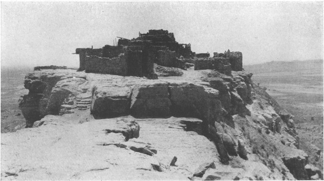 The Moki Indian pueblo of Walpi, in northeastern Arizona,
stands on a mesa high above the plain