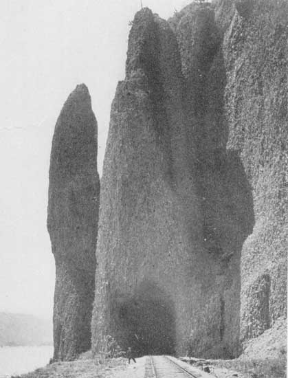 Along the Columbia&mdash;"Grotesque rocks rise sheer from the
river's edge"

