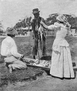 A RELIC OF THE SLAVERY DAYS&mdash;OLD SLAVE BUYING FISH.