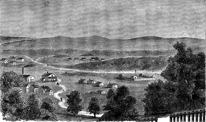 White clapboard buildings
of various sizes and a stockaded fort.