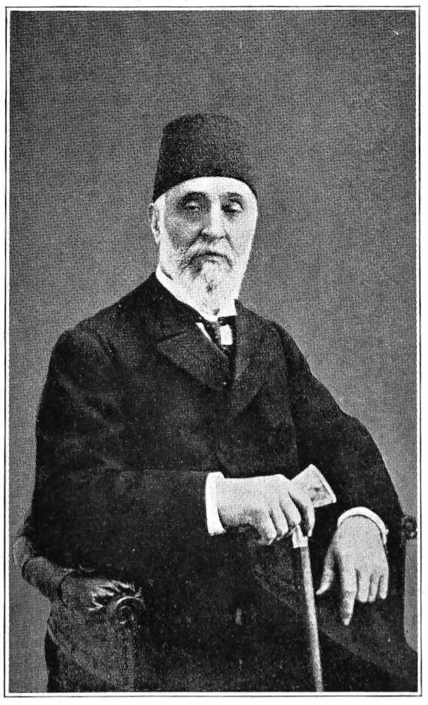 3/4-length photo against dark background